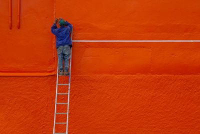 Man making ladder hanger